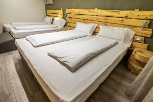Posteľ alebo postele v izbe v ubytovaní Chalet Margoni
