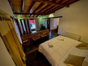 En eller flere senge i et værelse på Posada Con Los Ángeles