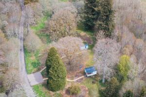 an aerial view of a house in the middle of trees at Bamff Ecotourism in Alyth