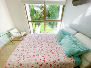 Ένα ή περισσότερα κρεβάτια σε δωμάτιο στο 2BR Condo in Paradise Resort at Riviera Maya +55 φωτογραφίες