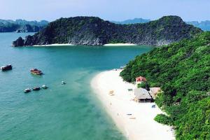an aerial view of a beach with boats in the water at Tran Chau Garden Home in Cat Ba