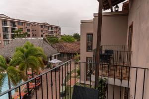 an apartment balcony with a view of a resort at Hotel Cubitá Boutique Resort & Spa in Chitré