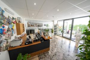 an office with a reception desk in a building at Hotel Auditorium in Bari