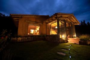 a house at night with the lights on at Cuesta Serena Boutique Hotel in Huaraz