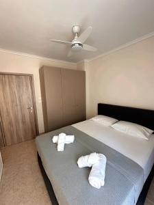 Postel nebo postele na pokoji v ubytování DIARA APARTMENT