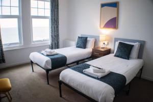 En eller flere senger på et rom på Shanklin Beach Hotel