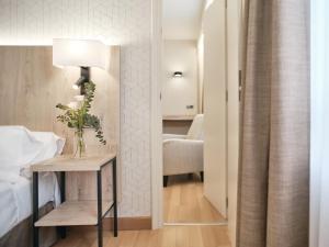 Postel nebo postele na pokoji v ubytování Hotel Albret