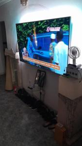 a flat screen tv hanging on a wall at Magodo Treat in Lagos
