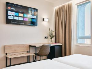 TV a/nebo společenská místnost v ubytování Hotel Albret