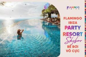 a man standing in a pool at a party at a resort at Flamingo Hai Tien - Căn hộ 2 phòng ngủ view trực diện biển in Thanh Hóa