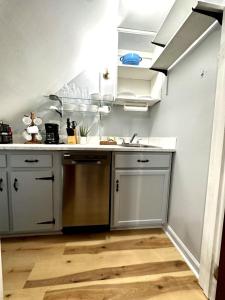 a kitchen with a sink and a counter top at Private 1BR Mins to Downtown, Serene Backyard in Gastonia