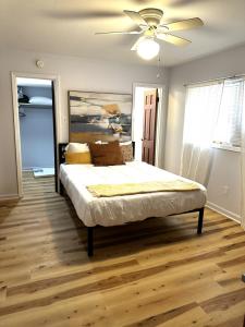 a bedroom with a bed with a ceiling fan at Private 1BR Mins to Downtown, Serene Backyard in Gastonia
