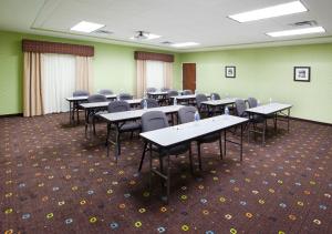 a classroom with tables and chairs in a room at Holiday Inn Express Hotel & Suites Van Wert, an IHG Hotel in Van Wert