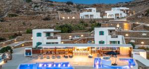 an aerial view of a building with tables and chairs at Ios Sea View in Ios Chora