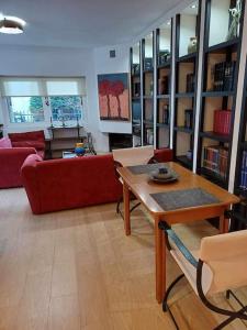 a living room with a couch and a table at Anatoli apartment in Mytilene
