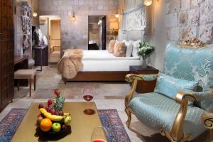 A bed or beds in a room at Cappadocia Pegasos Cave Suite Hotel