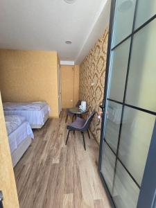 Letto o letti in una camera di KHORGO