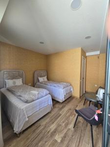 Letto o letti in una camera di KHORGO