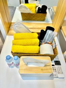 two baskets of towels sitting on a table with towels at Look Home Guesthouse in Seoul