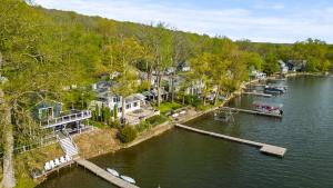 an aerial view of a river with houses and a dock at Luxury Conesus Lakeside Dock Modern Amenities in Livonia