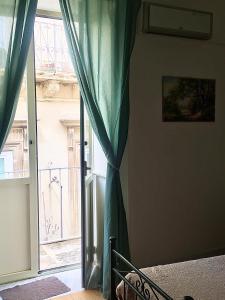 Postel nebo postele na pokoji v ubytování B&B Domus Gaetani