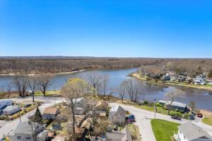 an aerial view of a small town next to a river at Oakland Beach Cottage - Sleeps up to 4 in Warwick