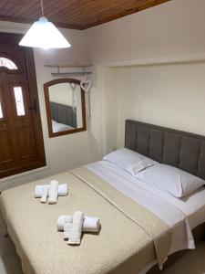Postel nebo postele na pokoji v ubytování Ambelos Skala