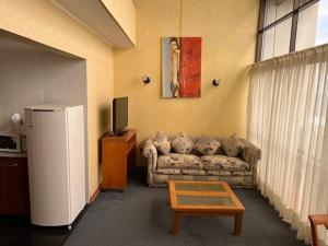 Ein Sitzbereich in der Unterkunft Hotel Florencia Suites & Apartments