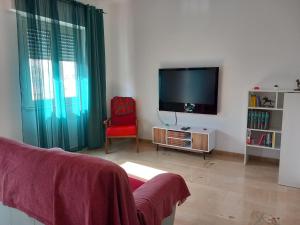 TV a/nebo společenská místnost v ubytování Domus Oreto + 11 fotografií
