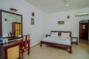 Postel nebo postele na pokoji v ubytování Lagoon Bentota Resort + 22 fotografií