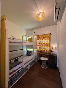 Ein Bett oder Betten in einem Zimmer der Unterkunft Chiza hostel Chiangmai
