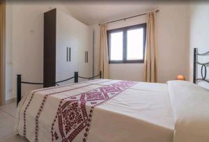 Ένα ή περισσότερα κρεβάτια σε δωμάτιο στο Il Girasole - Appartaments