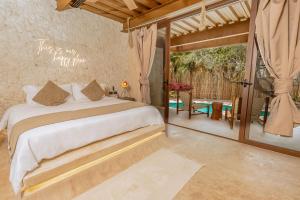 Postel nebo postele na pokoji v ubytování AWA Holbox Hotel Boutique - Beach Front