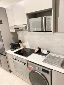 A kitchen or kitchenette at Luxury hotel Blackbrick Sandton 2