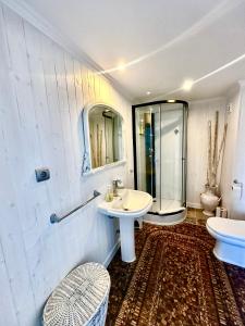 a white bathroom with a sink and a shower at Torrenueva , La Cala De Mijas , Vistamar , Go to costa in La Cala de Mijas