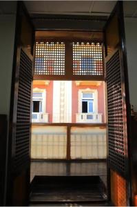 an open door to a room with a building at Mina Alsalam Hotel فندق ميناء السلام in Cairo