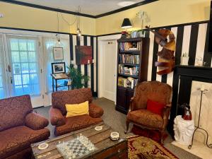 a living room with a couch and chairs and a fireplace at Bayberry Inn B&B and Oregon Wellness Retreat in Ashland