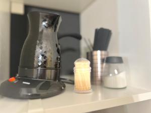 a blender sitting on top of a shelf at Mini Luxe Retreat in Volos