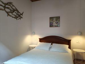 A bed or beds in a room at Mid century character house in Argostoli