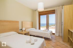 Postel nebo postele na pokoji v ubytování Villa Fustera by Abahana Villas