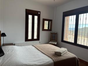 En eller flere senger på et rom på Casa Del Molino