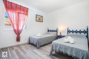 Postel nebo postele na pokoji v ubytování Villa Geminis by Abahana Villas