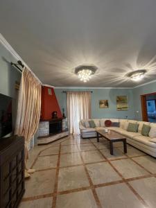 a living room with a couch and a table at My Paradise in Asíni