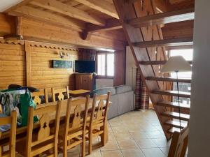 a dining room with a table and some chairs at Appartments in Tignes Ecrin des Neiges in Tignes