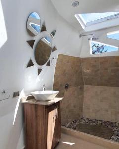 a bathroom with a sink and a shower at Sol y Luna Glamping in Málaga