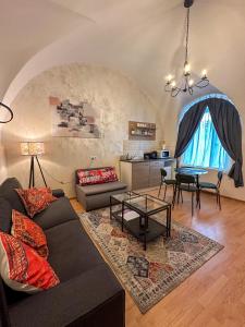 a living room with a couch and a table at Serenity House Apartments in Sibiu