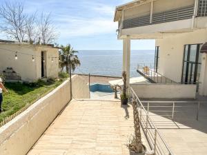 a view of the ocean from the balcony of a house at Currilave 664 in Durrës