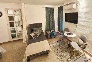 TV a/nebo společenská místnost v ubytování Design House Corrientes