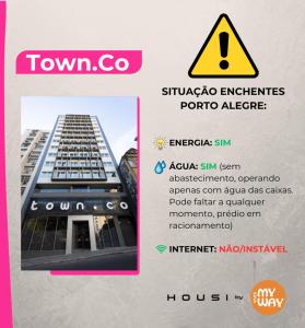 una imagen de un edificio con una señal de peligro en Town.Co Housi by My Way, en Porto Alegre