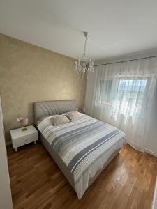 Säng eller sängar i ett rum på Apartment Nadaa